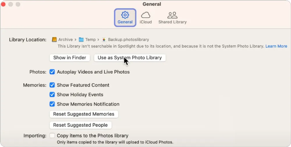Mac Photos settings window showing “Use as System Photo Library” button highlighted