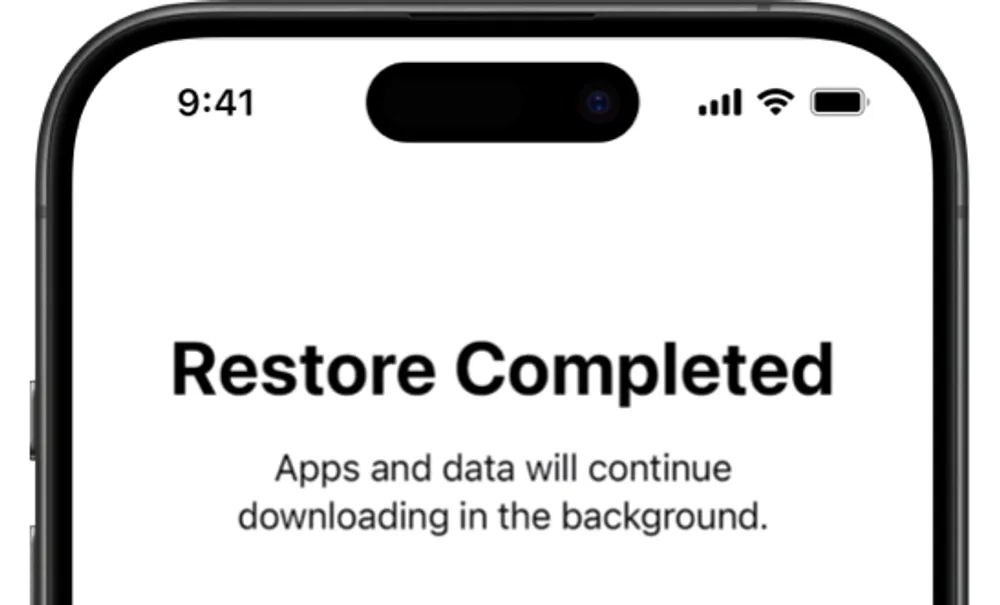 iPhone Restore Completed screen after downloading iCloud backup, reminding user that apps and data will continue downloading.