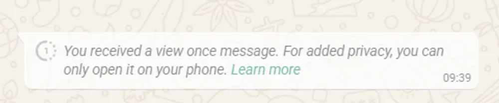WhatsApp displays a View Once photo as a notice saying “you can only open it on your phone” when received on web.