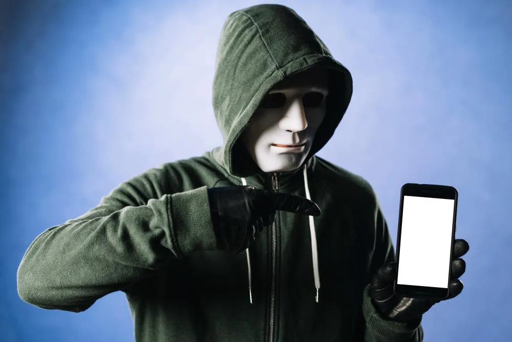 Hacker with smartphone